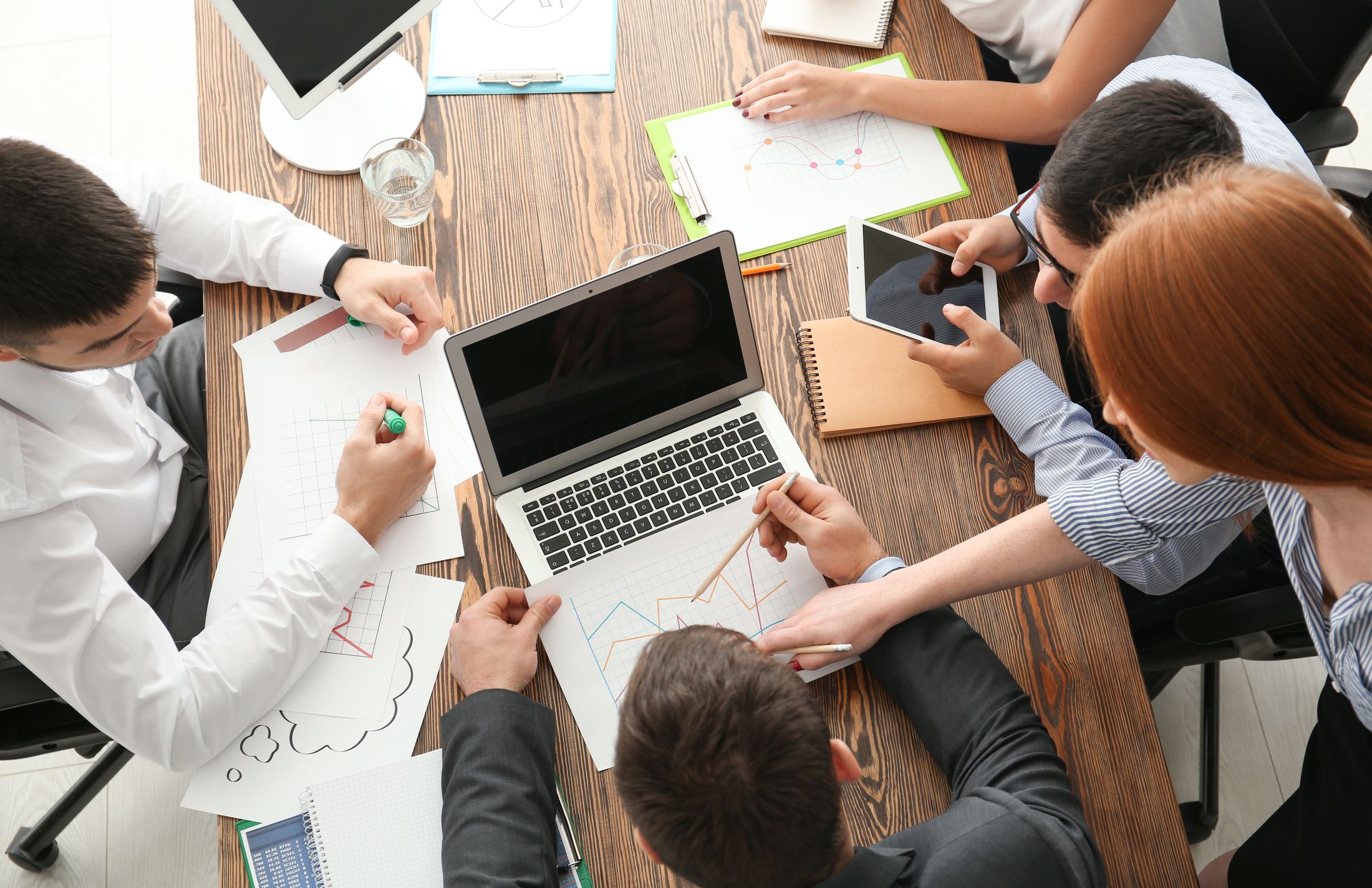 Young marketing expert with team at business meeting